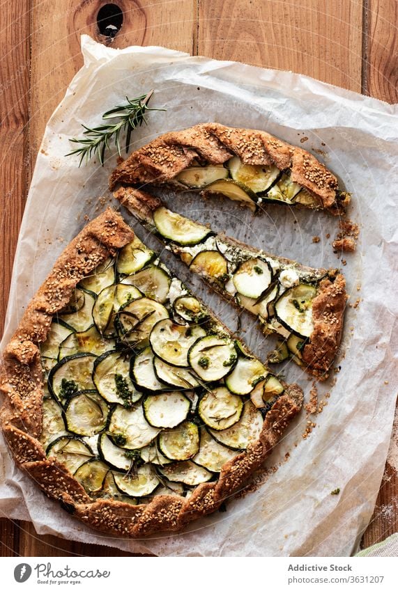 Zucchini galette on wooden table nutritionist tasty brunch feta cheese seasonal vegan cooking recipe healthy eating appetizers dining baked parchment paper