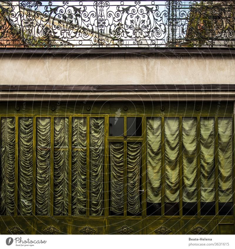 Old splendour: gathered glitter blinds and artistically forged balcony bars in Paris chic Prun Old fashioned glittery mica drapes stores Curtain Window Day