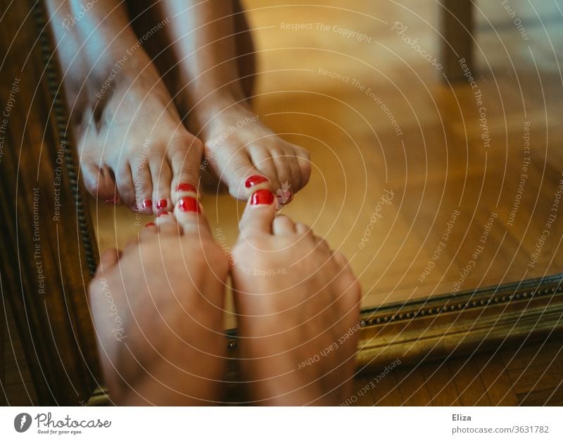 Feet with red painted nails, which are reflected in a mirror foot red nails Nail polish Pedicure Varnished toenails Barefoot Red Feminine Legs Skin Ground floor
