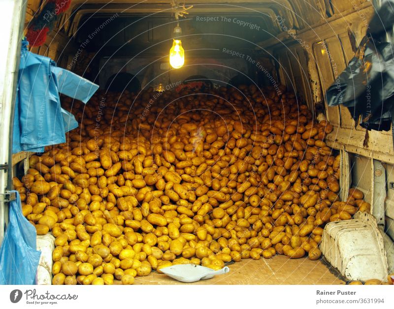 Back of a van filled with potatoes in Tibilisi, Georgia agriculture brown dirty food pile poor simple tibilisi Transport vegetable