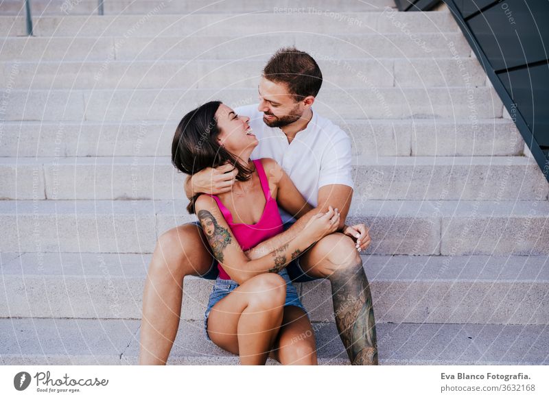 happy young couple outdoors. Family and love concept city lifestyle together togetherness tattoo caucasian female 2 woman romance summer girl smiling travel