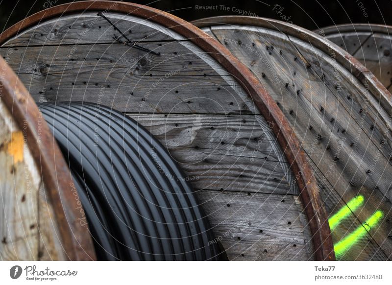 large cable drums on a construction site cable construction site wood plastic expensive new cable web cable internet cable electricity cable black