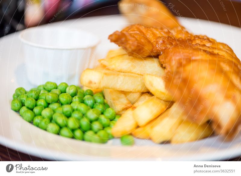 Traditional English Food such as Fish and Chips fish chips food peas mushy english crispy dinner british cod fried meal seafood french potato plate dish cooked