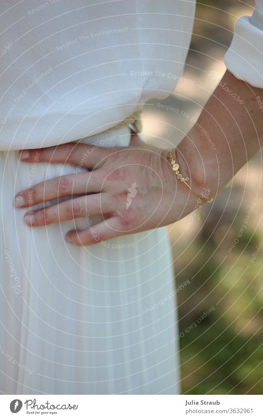 Hand with golden bangle Bride Wedding Gold Bangle Fingers pleated crease Pleated skirt Silk Silken White Cream Blouse Summer Nature