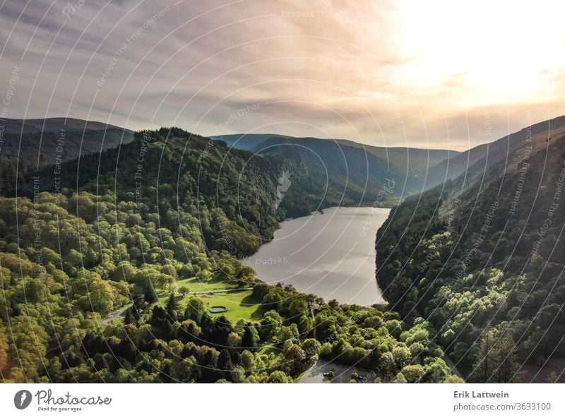 Beautiful lake in the mountains - aerial flight footage forest landscape nature travel water green outdoor park reflection scenic sky view glendalough beautiful