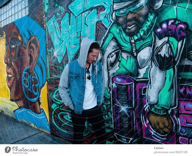 Man behind graffiti wall Graffiti Art Spray Colour colourful To go for a walk person Model Magazine human Downtown