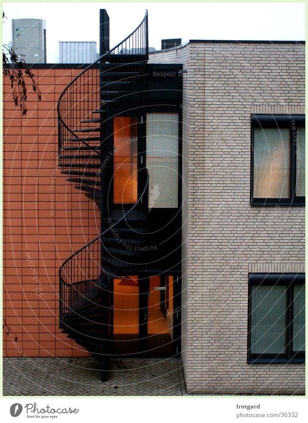 spiral staircase Winding staircase Reddish white Architecture Stairs steel staircase geometrical shapes clear lines Exterior shot