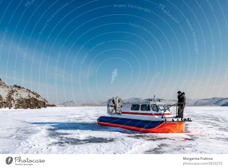 Hovercraft on the lake in winter air baikal blue boat cold combat cushion fast force landscape lcac marine motor nature outdoor propeller river sea shore