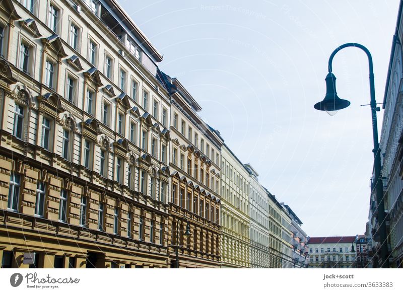Symmetry | in Prenzlauer Berg Facade Sunlight Apartment Building Housefront Residential area streetlamp Perspective Cloudless sky Architecture Row Authentic Old