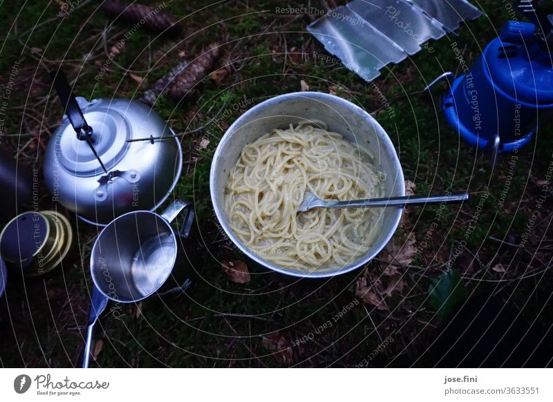 Dinner on an outdoor trekking tour, cooked on a gas burner. Exterior shot hikers Break Forest Nature Leisure and hobbies Adventure backpacker Eating Wilderness