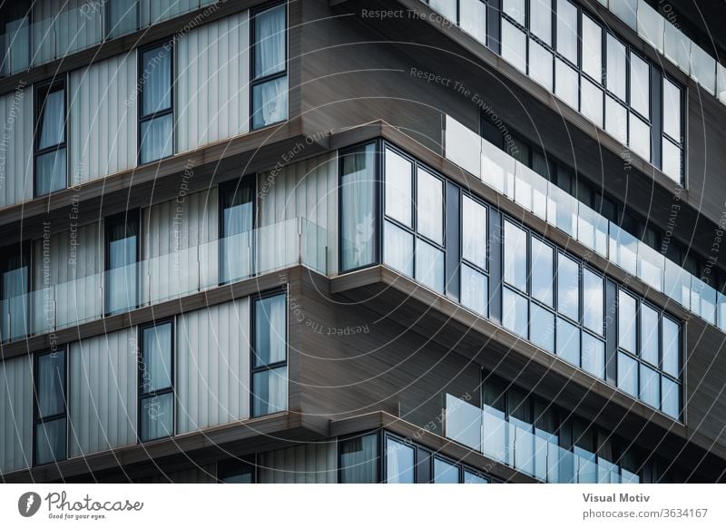 Architecture detail of the glass balconies of a minimalist urban building architecture balcony abstract windows facade exterior repetition pattern row outdoors
