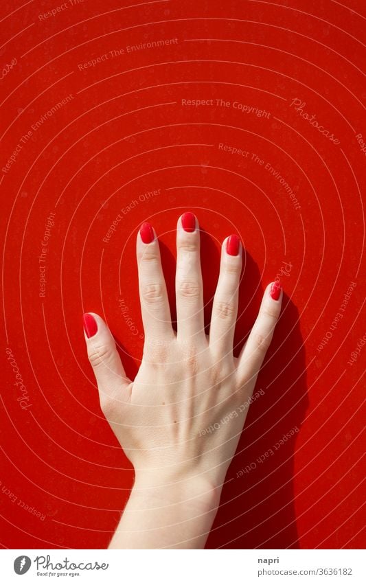 Signal effect | female hand with red painted fingernails on red wall. Red by hand Young woman Fingers Nail polish feminine already Touch Feminine Groomed
