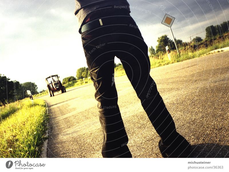 tractor stop Hitchhike Tractor Stand Snapshot Style Pants Street sign Flexible Photographic technology Human being stops Lighting Wait Funny fearless