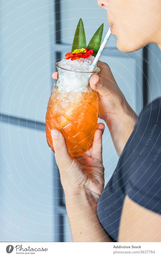 Crop woman having cocktail in pineapple shaped glass refreshment straw drink female summer fruit exotic relax vacation alcohol beverage tropical juice sweet