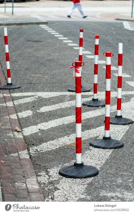 White and red traffic cones bunch risk boundary accident security caution pavement industrial pedestrians outdoors urban closeup warning street safety road