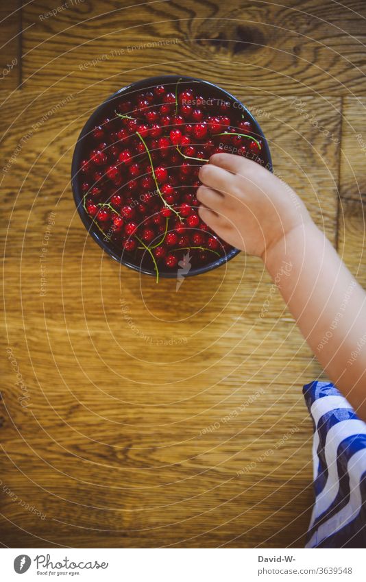 Child reaches with his hand for fresh berries Berries by hand hands Fingers Toddler Healthy Eating vitamins Organic produce Delicious Vitamin-rich