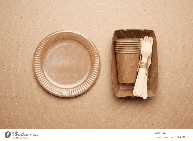 paper plates and cups from brown craft paper and wooden forks background biodegradable box cardboard catering concept container cutlery design dining dinnerware