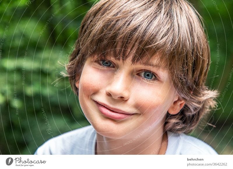 I'm done smiling now? cheerful Happiness Close-up Sunlight Face Happy Child Boy (child) portrait Light Detail Trust Colour photo Day Son Together Love