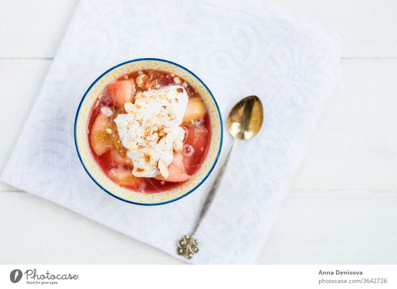Rhubarb and apple compote with coconut yogurt and oatmeal crumble berry healthy snack detox fruit cake cobbler food rhubarb strawberry wooden pan sweet dessert