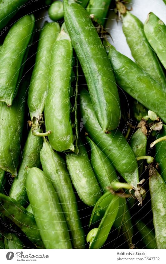 Top view macro image of sweet peas green vegetable organic food produce harvest vegan diet ingredient healthy nutrition pod spring vitamin legume cooking
