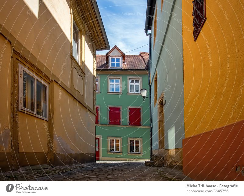 Colourful old town alley in Bamberg Bavaria Franconia Alley Old Town Lane built houses Architecture Facades Window variegated colourful Roof pavement