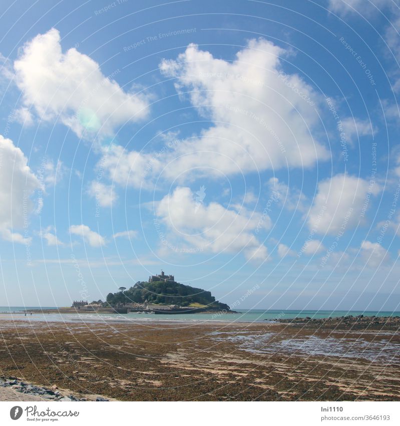 St Michael's Mount View over the Wadden Sea with clouds in the blue sky England Low tide watt Algae Tidal Island shot Tourist Attraction Monument Blue sky