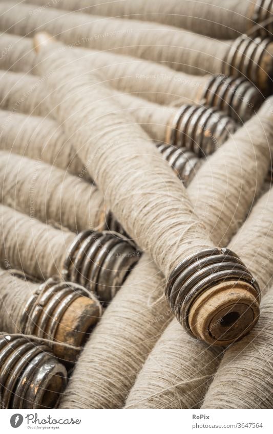 Yarn of linen for processing on the loom. Rinse yarn Roll colors variegated roll cable drum rope drum textile wickerwork Spinning mill company Company Economy
