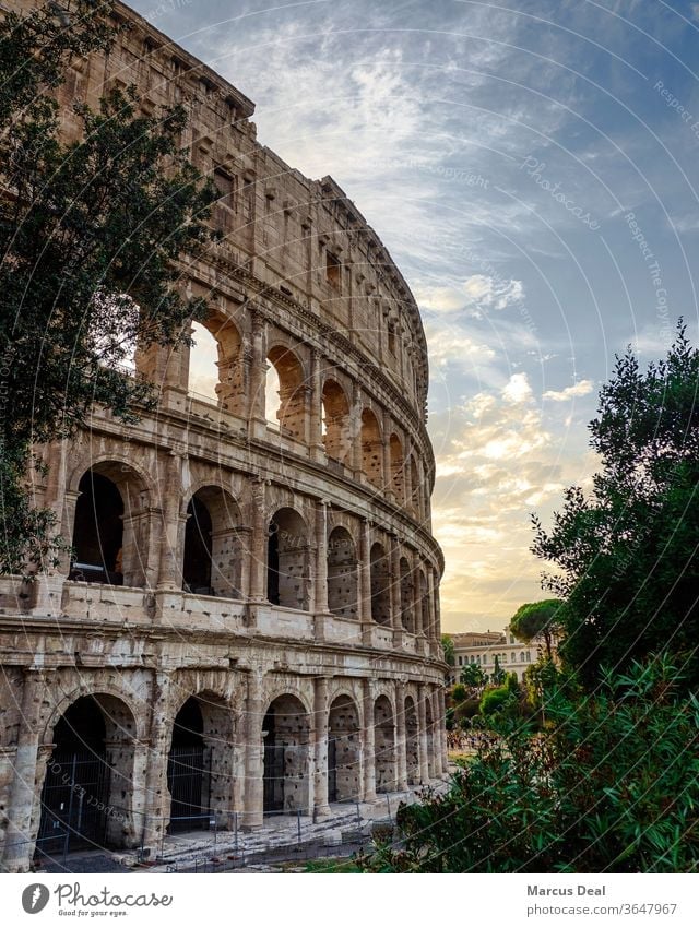 The Colosseum at sunset with clear sky Rome colosseum colosseum rome italy roman roman architecture old historical landmark tourist travel europe