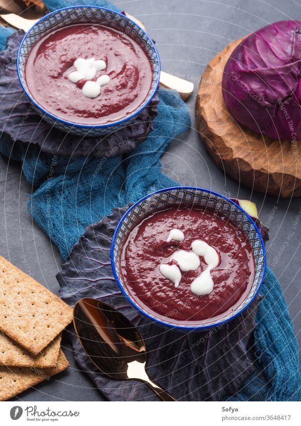 Light red cabbage cream soup in bowls food vegan vegetarian leaf lunch healthy dinner meal vegetable plant based cuisine dish delicious sweet potato purple