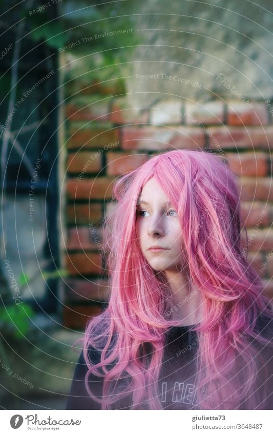Portrait of a teenage girl with long pink hair portrait Shadow Light Day Exterior shot Colour photo Puberty Emotions Long-haired 13 - 18 years