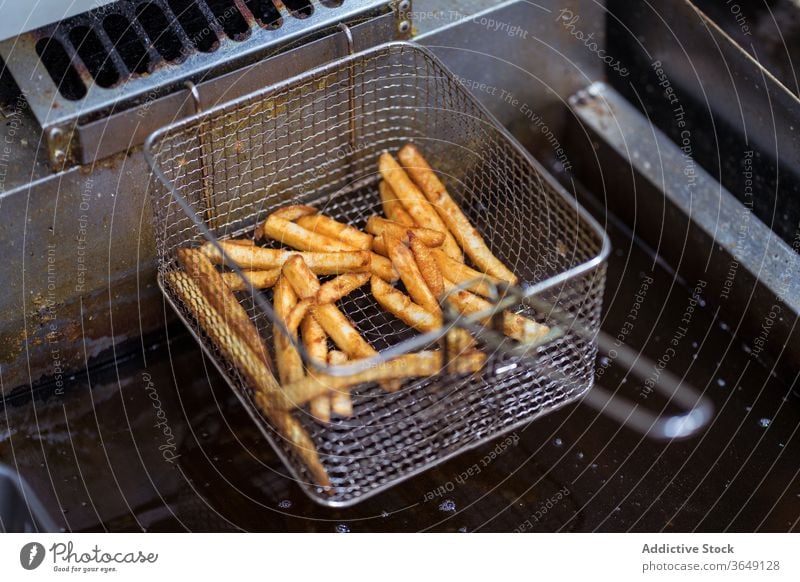 Delicious French fries in metal container french fries kitchen cafe delicious crispy tasty cook meal food cuisine dish prepare yummy cafeteria fast food