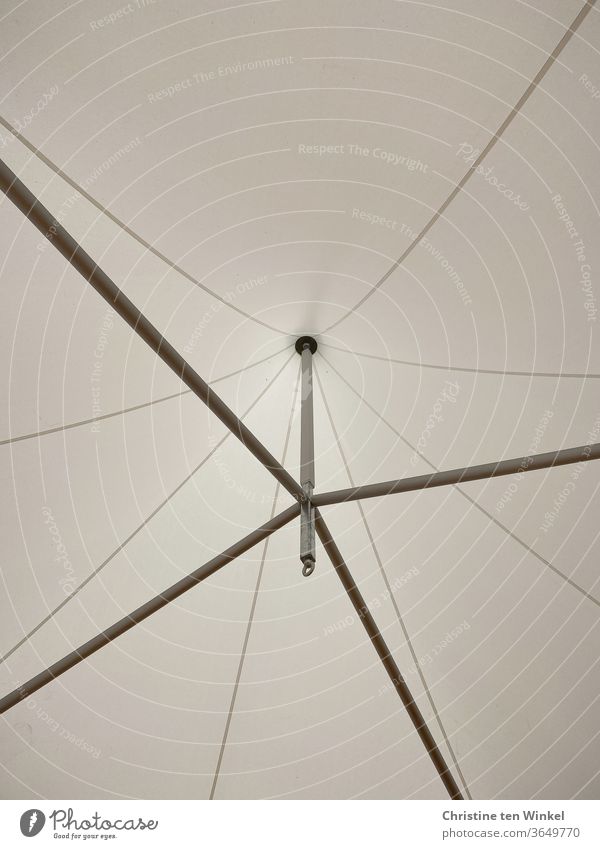 symmetrical | view upwards into a bright tent dome with seams and metal poles Tent dome tent roof Bright light-coloured fabric Interior shot metal rods Upward