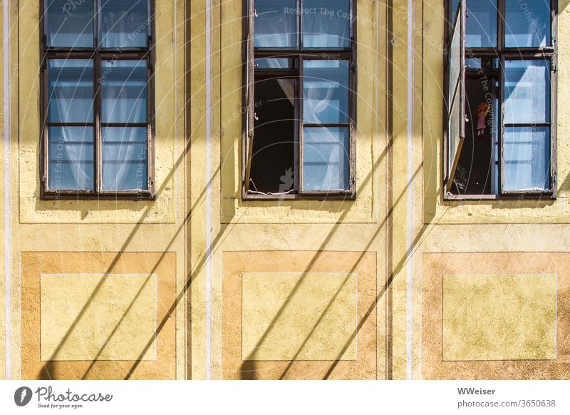 Oblique shadows on an old façade Facade Window Open Shadow diagonal curtains drapes conceit room Insight House (Residential Structure) Yellow Old Historic