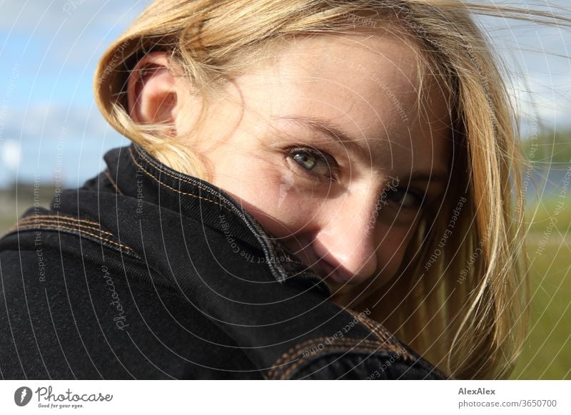 Lateral portrait of a young, blond, smiling woman Woman Young woman Blonde already Slim laterally Long-haired windy Esthetic Summer Trip Beautiful weather Model