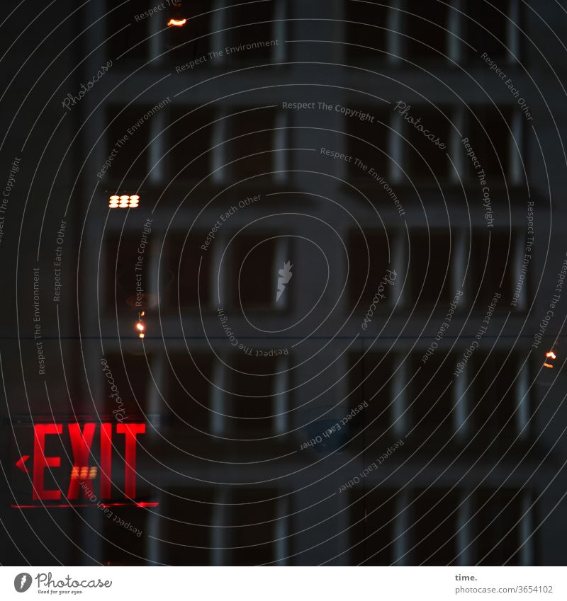 At the end of the night please keep left exit Way out Red conceit at night Artificial light reflection somber Mysterious Inspiration Creepy Direction Arrow