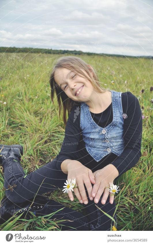 happy girl in the meadow with flowers on her hands Child Infancy Freedom fun Joy Nature meadow flowers Meadow summer meadow Summer Happiness Grass Sit Laughter
