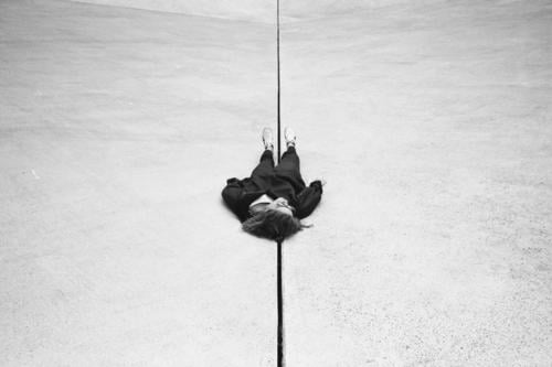 In the exact middle of nowhere Black & white photo Girl Woman lying on the ground Frustration Relaxation depression Lost dead having a rest Art relax relaxation
