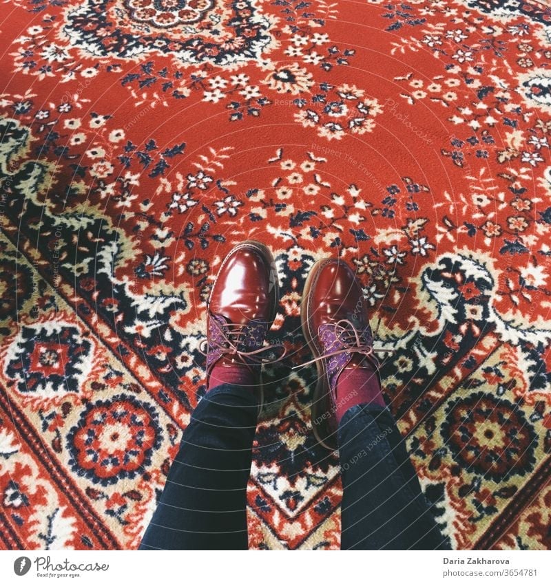 red shoes on red soviet carpet Perfect match Feet Carpet Legs Footwear Floor covering maroon Brown Pants Woman Clothing Feminine Jeans Colour photo Fashion Red