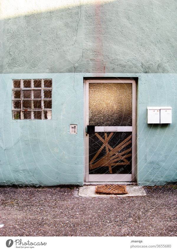 entrance House (Residential Structure) Wall (building) Facade door Old Entrance Gloomy built Dirty Closed Window Mailbox Broken Blue green Vandalism