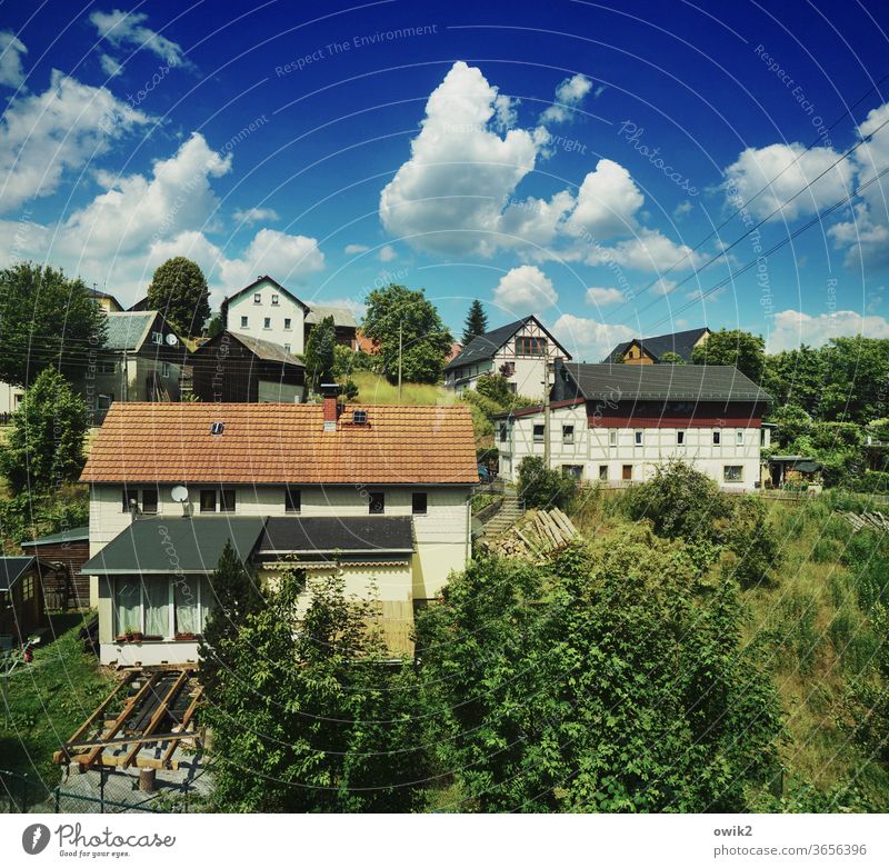 Village landscape houses Half-timbered facade Window roofs huts Idyll Sky Clouds natural close to nature Veranda Village idyll Exterior shot Colour photo