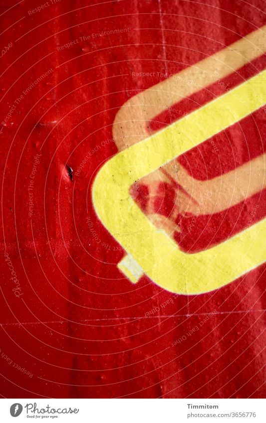 Partial view of a billboard Poster Paper Fruck crease Red Yellow round Advertising Detail Billboard Colour photo Deserted