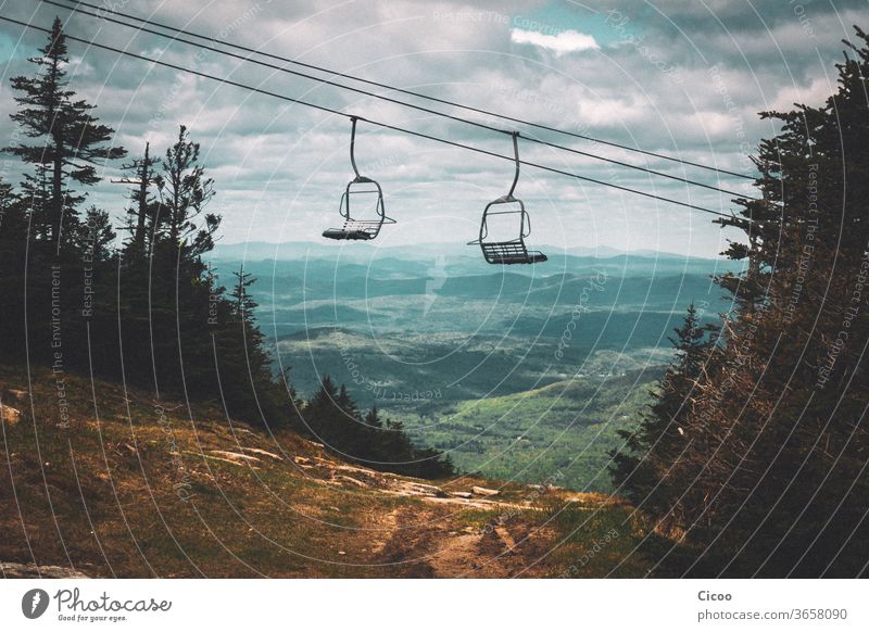 Empty chairlift in summer over green landscape chair lift elevator Ski piste Summer Dirty outlook farsighted farsightedness Landscape Nature Sky Exterior shot