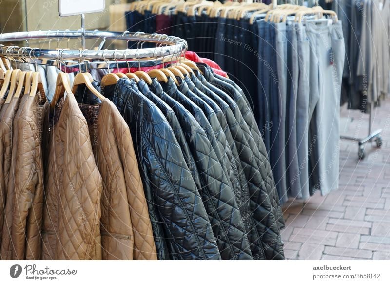 quilted jackets and jeans for sale fashion shopping winter coat clothing clothes boutique store casual display retail hanger rack wardrobe collection garment