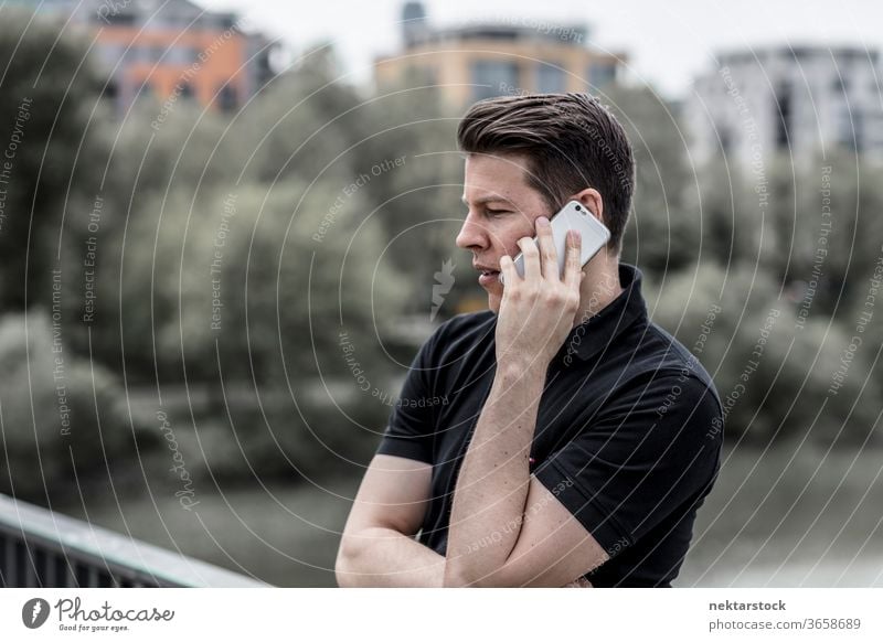 Profile of Man Talking on a Phone mobile phone talking man adult close up profile telecommunication technology electronic gadget conversation hand