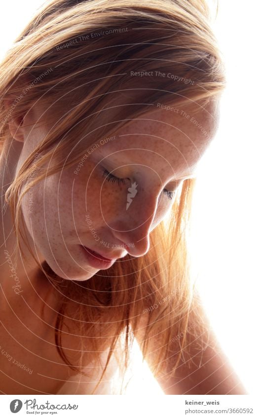 Face of a redheaded woman with many freckles and closed eyes in front of a white background Woman Red-haired Freckles exempt Lips eyes closed Nose Long-haired