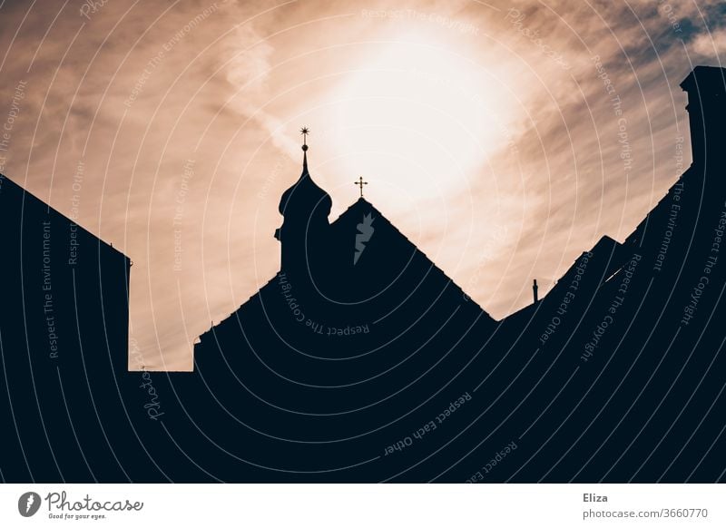 Silhouette of a church with a steeple against the light Church Church spire house of God Belief Religion and faith Christianity Back-light impressive Holy