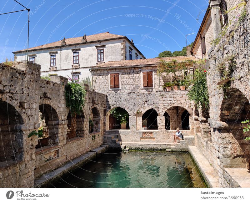 Old medieval fish pond, garden and dovecot in Tvrdalj castle in Stari grad, Hvar island, Croatia. Castle Historic Architecture Exterior shot Tourist Attraction