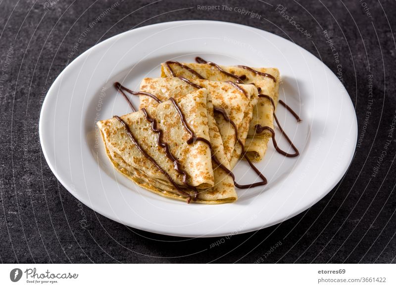 Sweet crepes with chocolate on black background Crepes blinis breakfast cocoa delicious dessert dough food fresh homemade pastry plate recipe russian slate