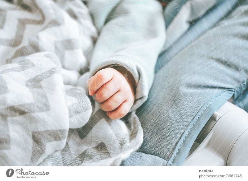Little hand of a newborn baby love cute new born child birth first month girl boy family daughter son lovely adorable real tired sleep calm quiet lying