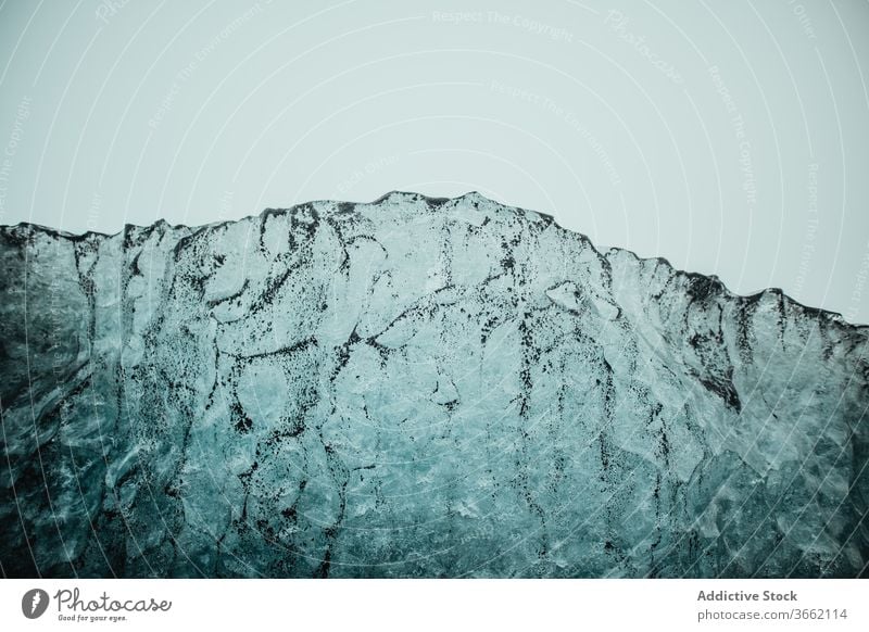 Rough surface of picturesque ice glacier under gray sky texture crystal frozen frost winter cloudy pattern cold jokulsarlon iceland chaotic abstract idyllic